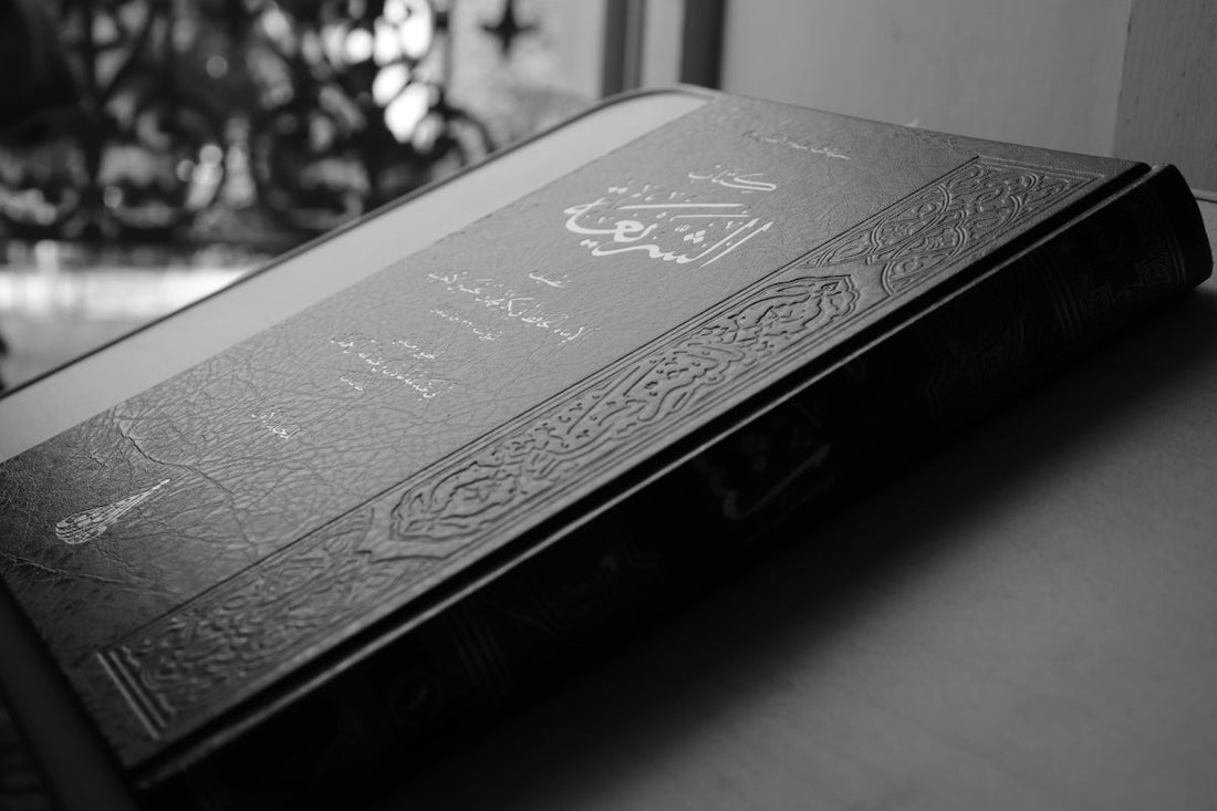 A closed, ornate book rests on a surface