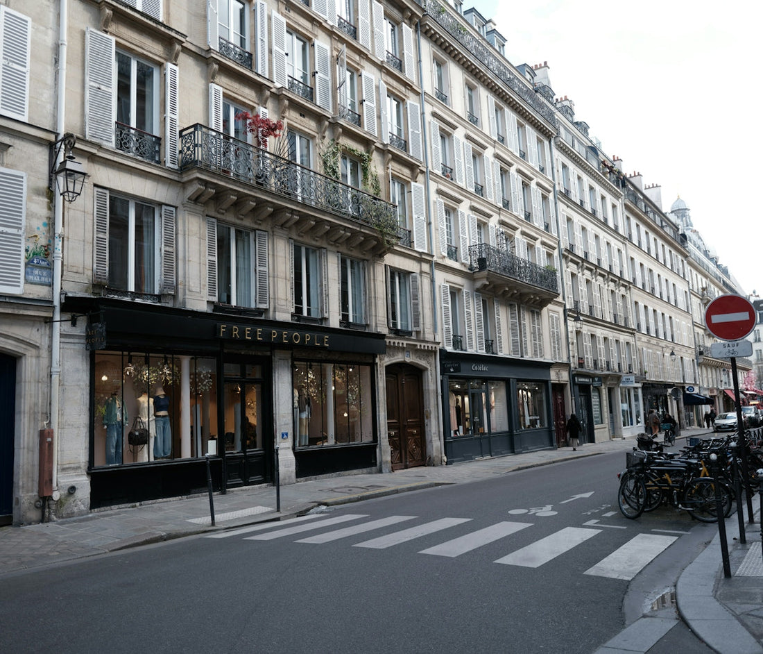 Street view of buildings with shops and parked bicycles