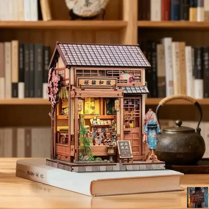 Maison miniature en bois pour bibliothèque - © 2026 Le Grimoire Ancien