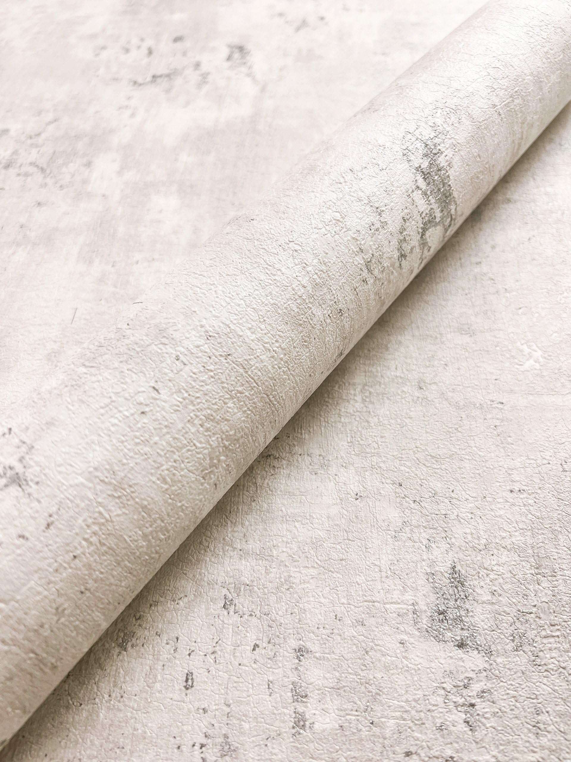 Papier peint intissé effet enduit béton métallique | Newroom Tyana — Noir, Bleu, Gris & Beige - © 2026 Le Grimoire Ancien